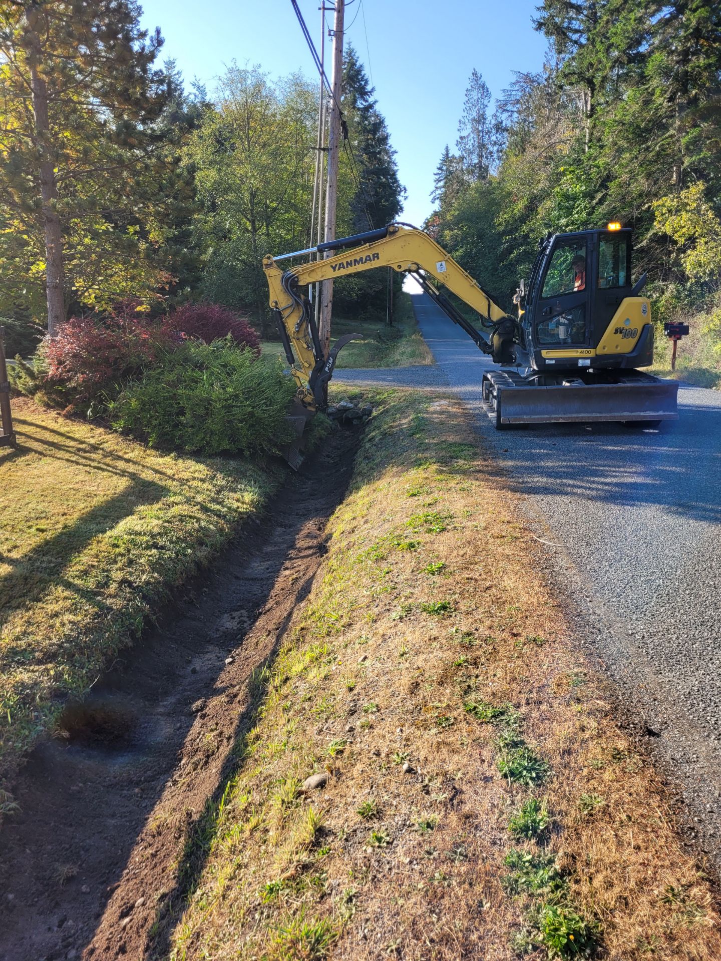 tractor clearing ditch